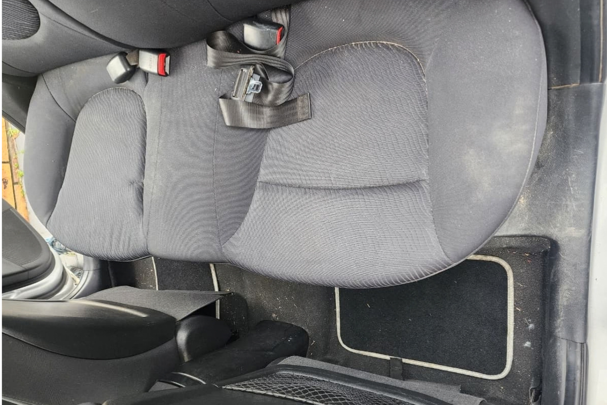 Car back seat before interior cleaning service